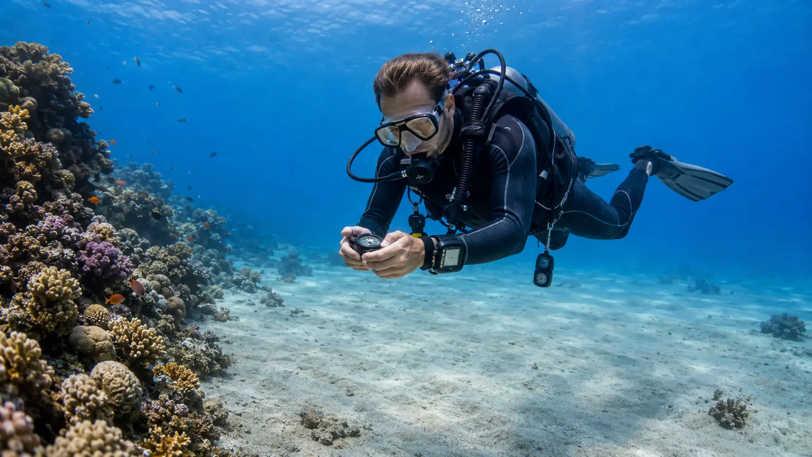 Scuba diver practicing buoyancy and navigation near a Red Sea reef in Hurghada
